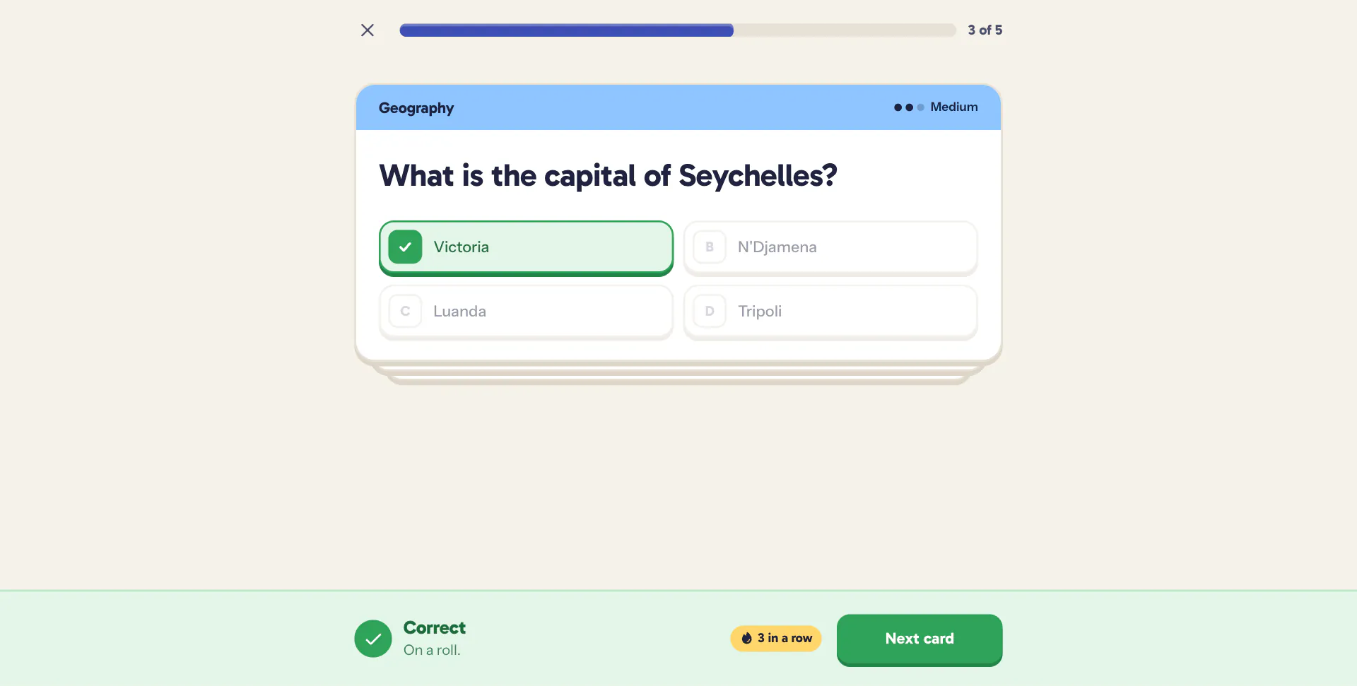 A right answer ticked in green, with a green banner and a three in a row chip