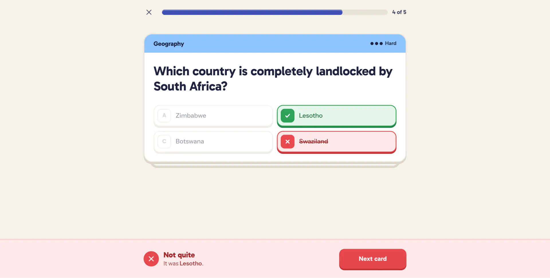 A wrong answer struck through in red, the right one ticked, and a red banner naming it